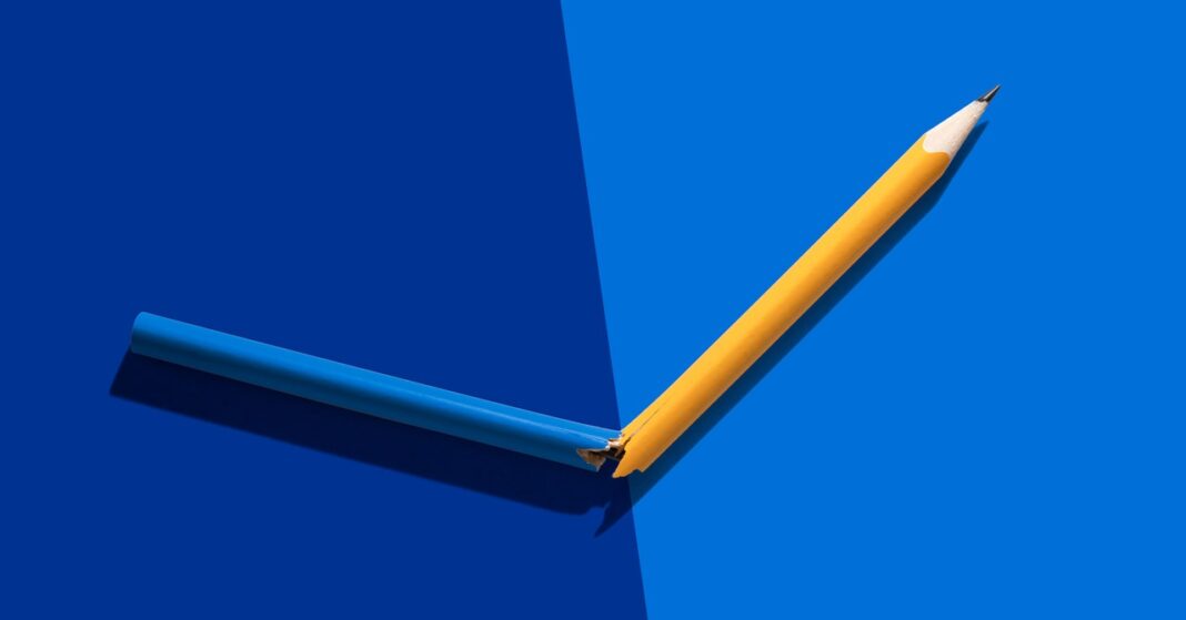 Broken pencil on blue background.