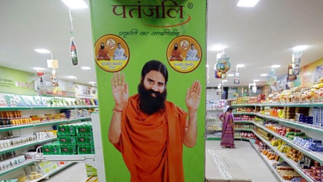 Indian grocery store aisle with advertisement standee.