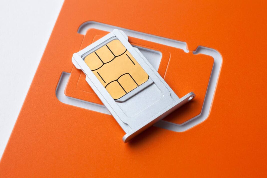 SIM card on orange background.
