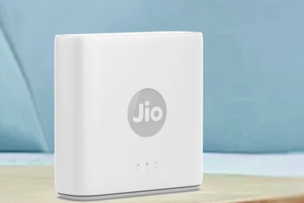 Jio white broadband router on a table.
