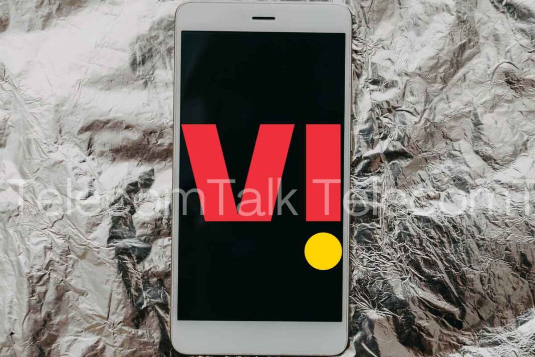 Smartphone on foil with red VI logo.