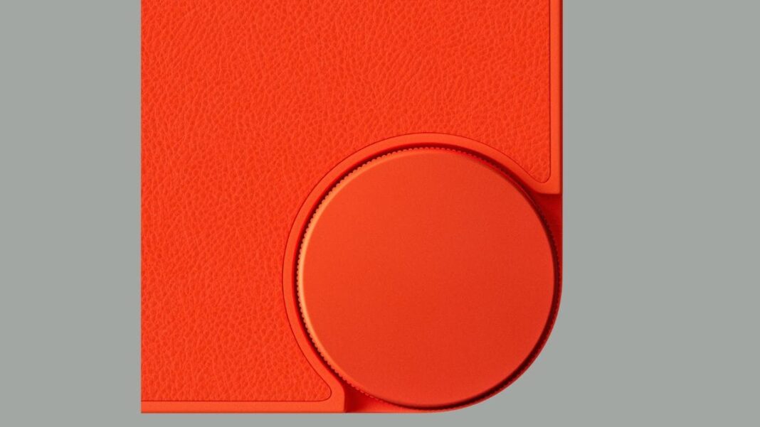 Red leather wallet and circular design detail.