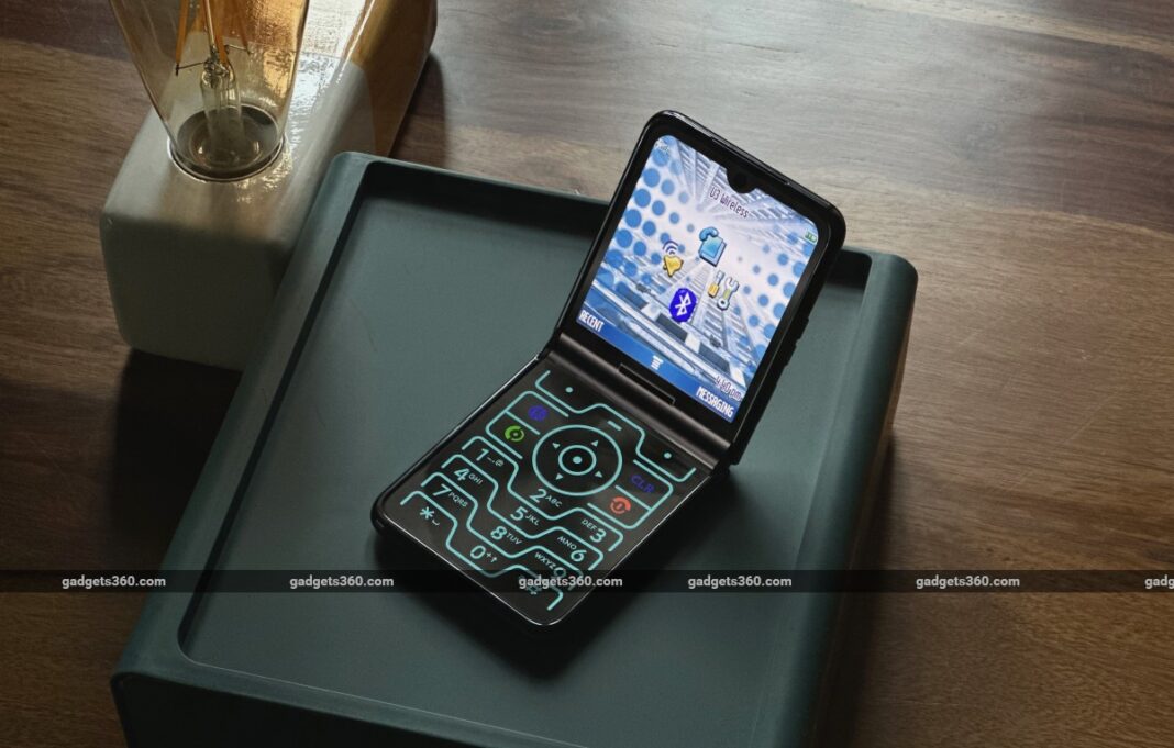Smartphone with futuristic interface open on desk.