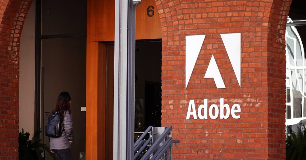 Person entering building with Adobe logo.