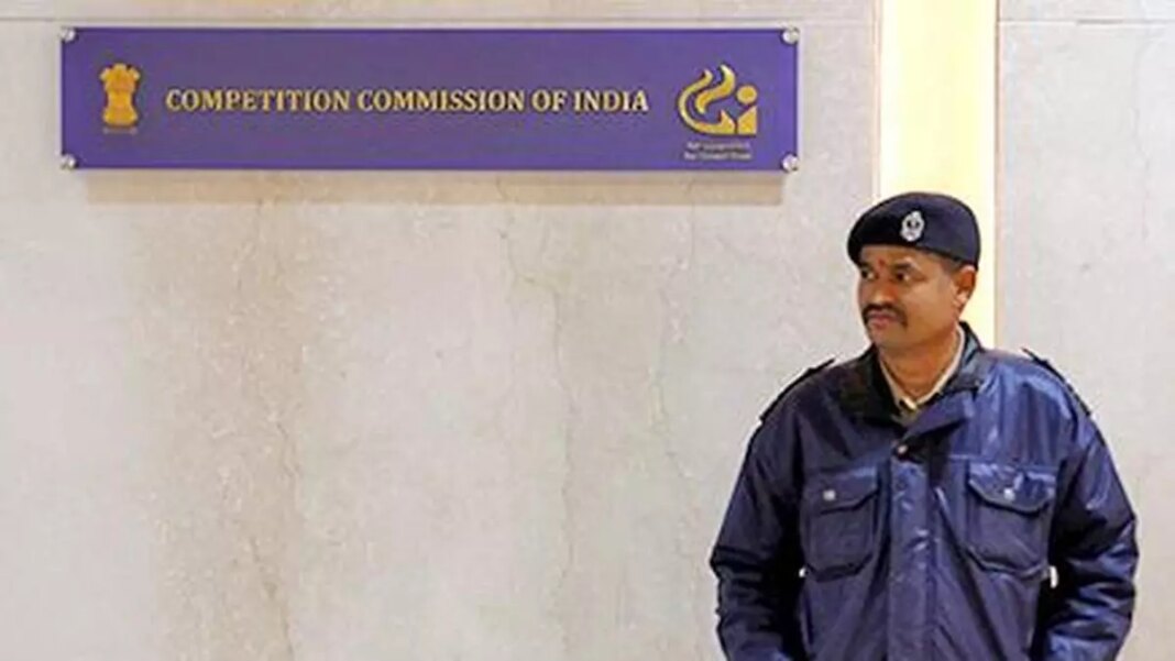 Security guard by Competition Commission of India sign.