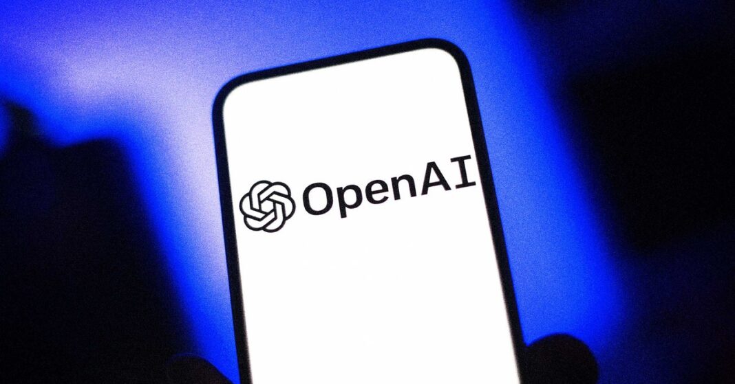 Hand holding smartphone with OpenAI logo on screen.