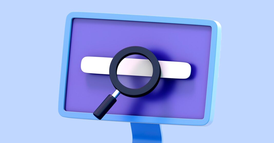 Magnifying glass on computer monitor, online search concept