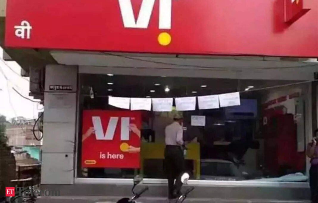 VI mobile network store front with customer.