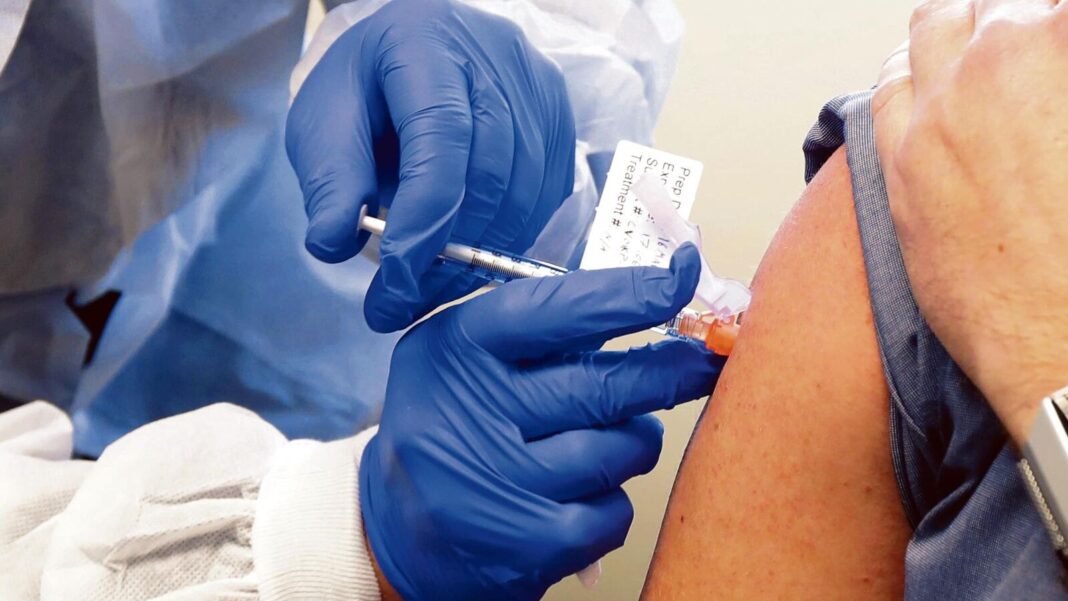 Person receiving vaccination shot