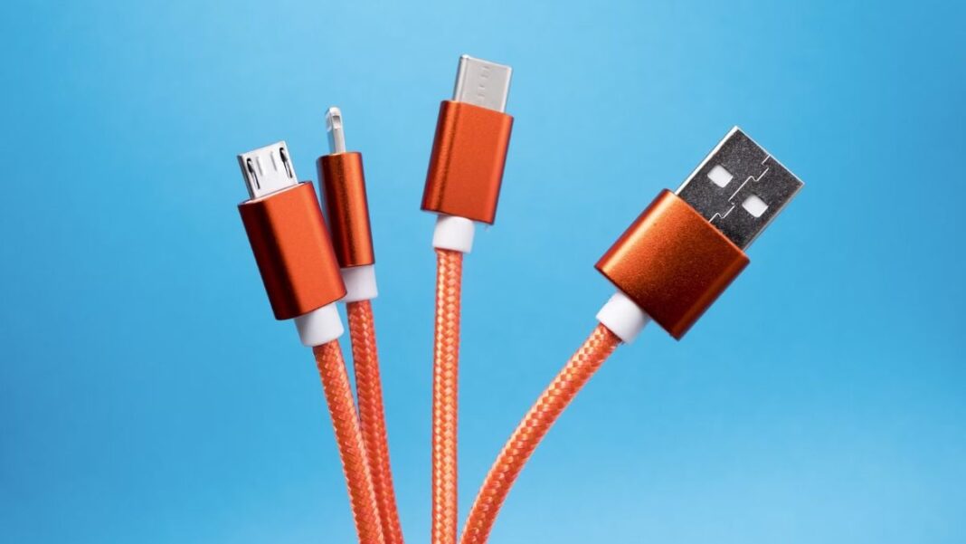 Various USB cables on blue background.