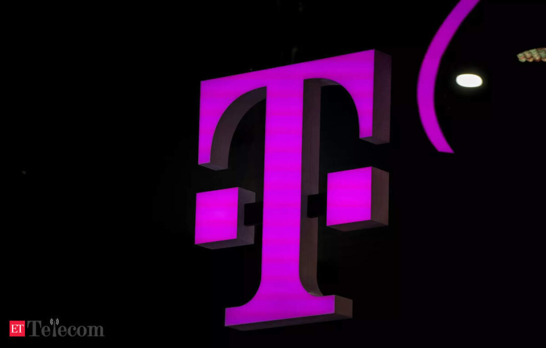 Illuminated magenta logo on dark background.