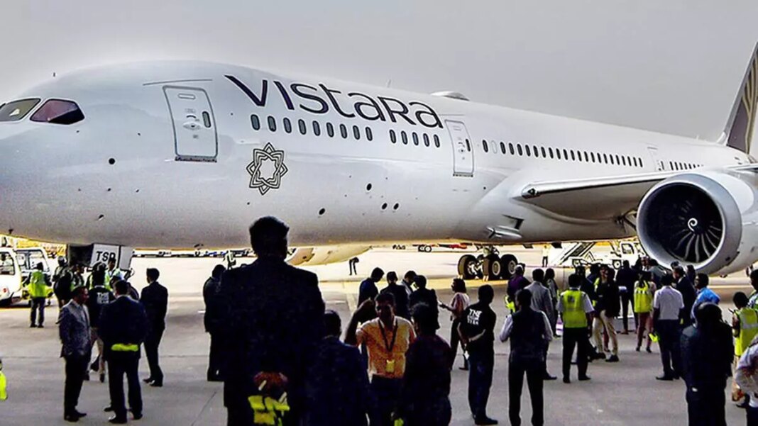 Vistara airplane on tarmac with crew and passengers.