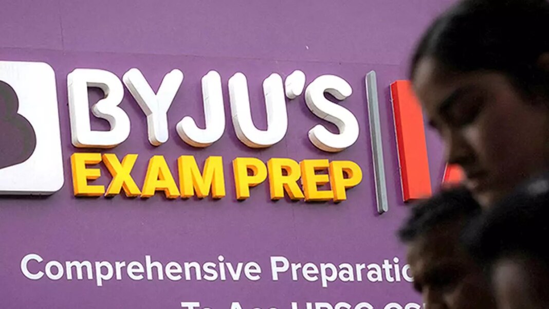 BYJU'S Exam Prep sign with blurred people foreground.