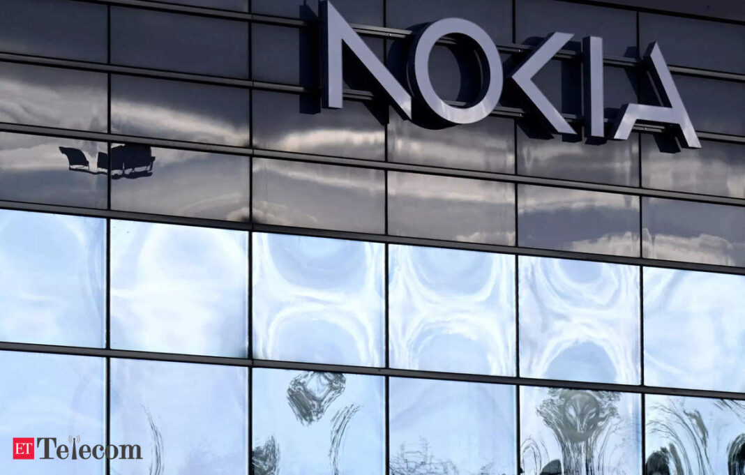 Nokia logo on glass building facade with reflections.
