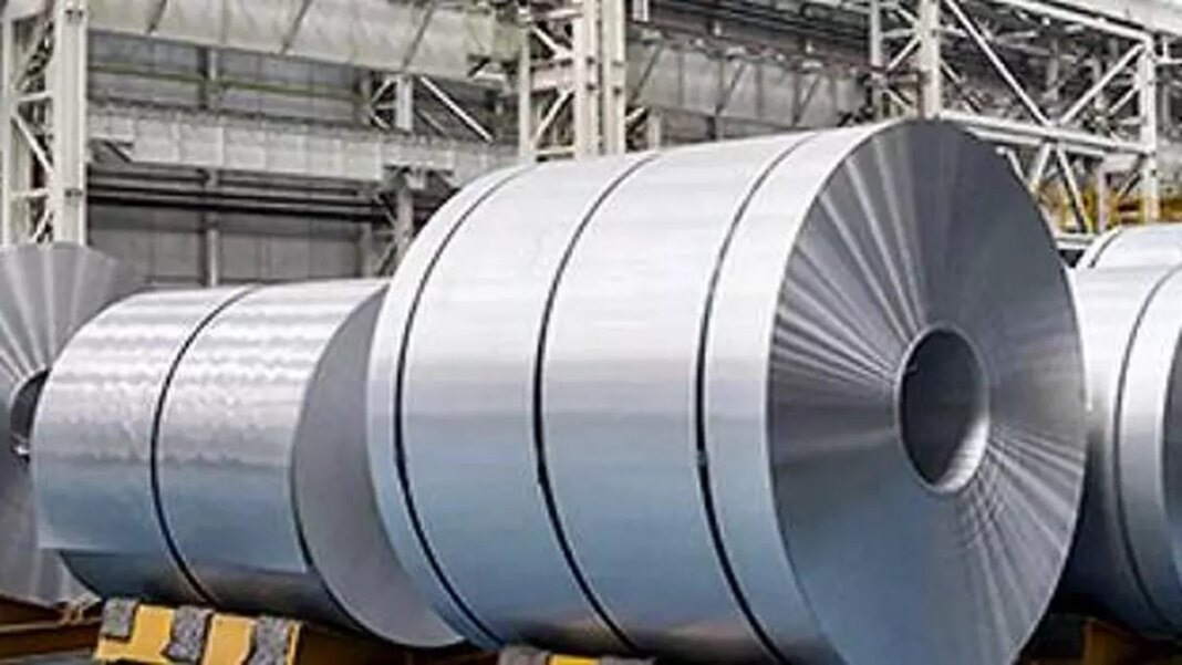 Industrial steel coils in warehouse.