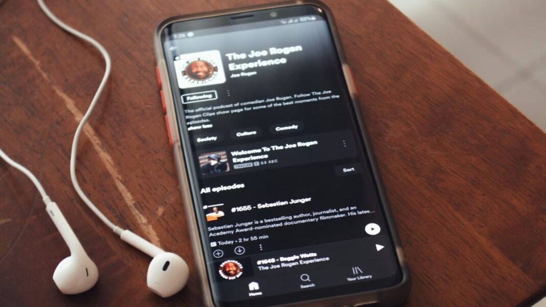 Smartphone displaying Joe Rogan Experience podcast app.