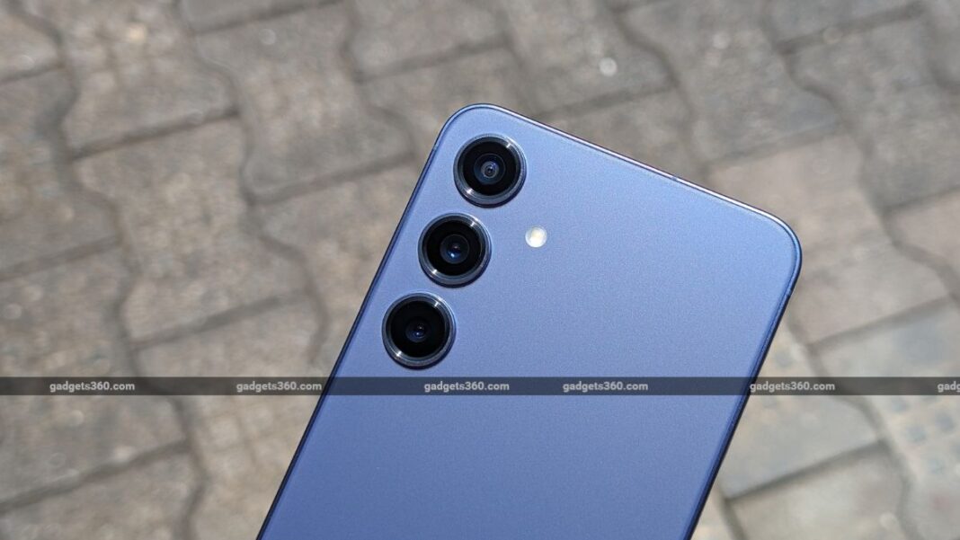 Blue smartphone with triple camera setup.