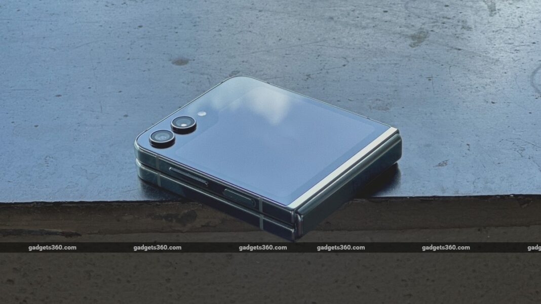 Folded smartphone on concrete surface.