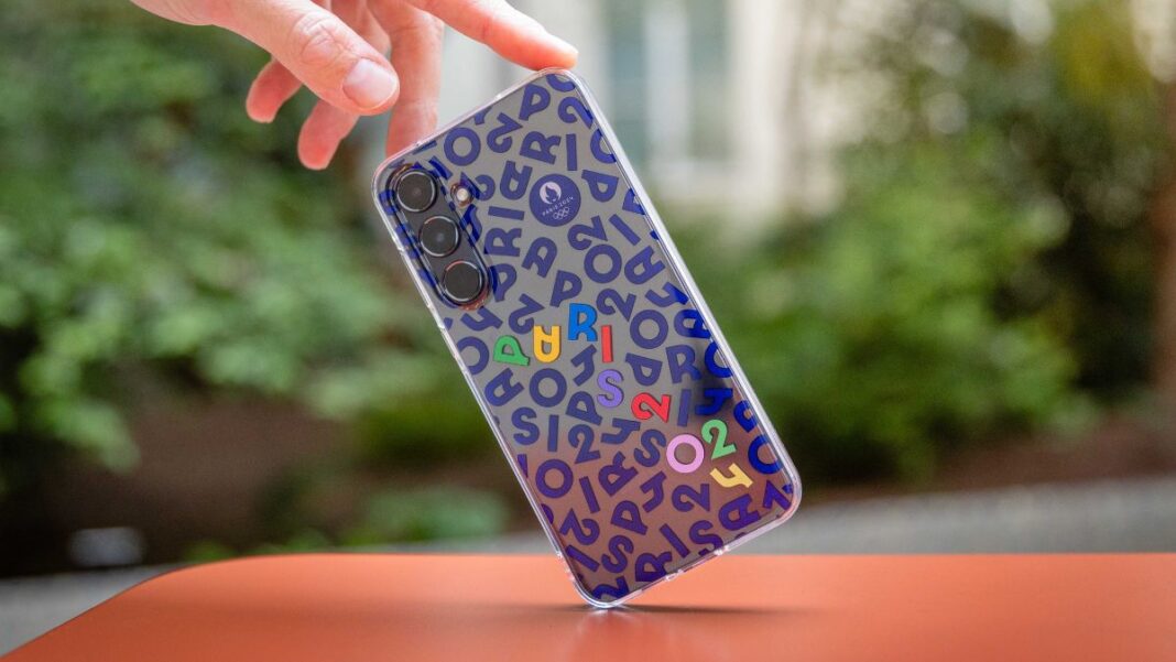 Hand holding a colorful smartphone with unique design.