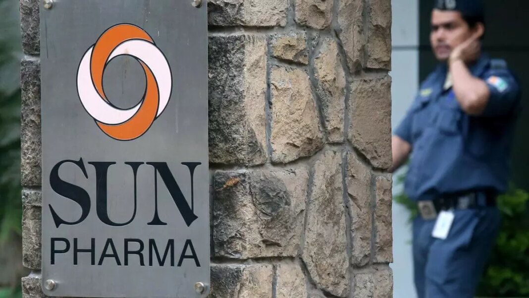 Sun Pharma sign with security guard in background.
