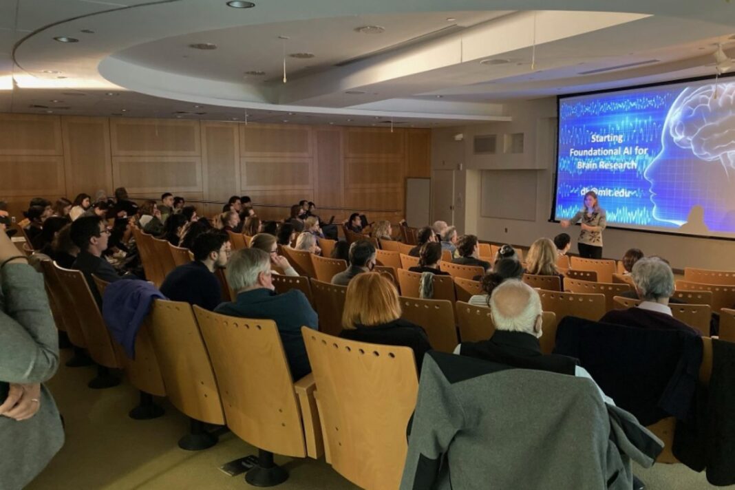 Audience at AI brain research lecture.