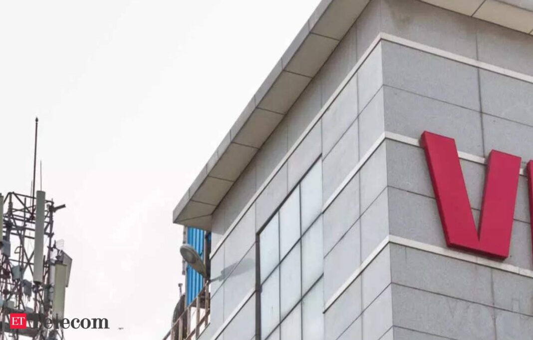 Telecom company building facade with red VI logo.