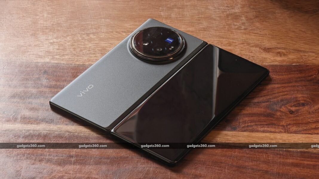 Vivo smartphone with circular camera module on wood.