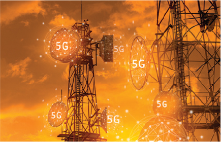 5G network towers at sunset with digital overlays