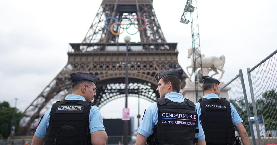 Security officers near Eiffel Tower, Paris.