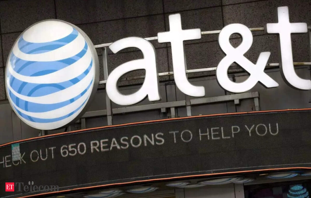 AT&T logo on storefront with promotional sign.