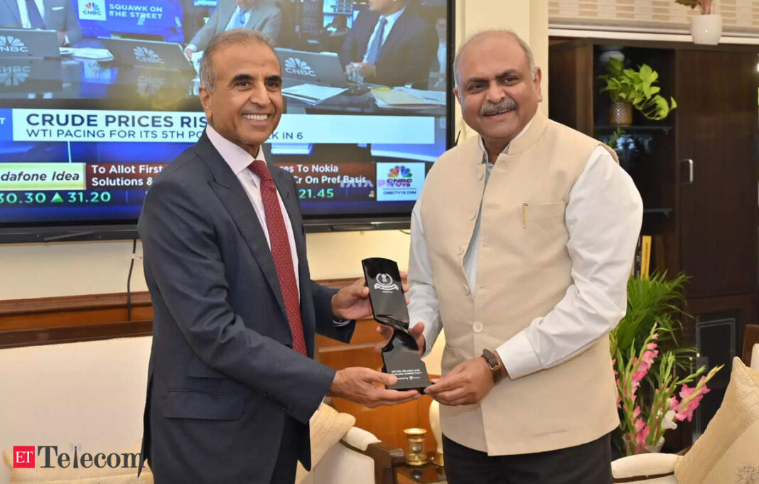 Two men exchanging award in office setting.