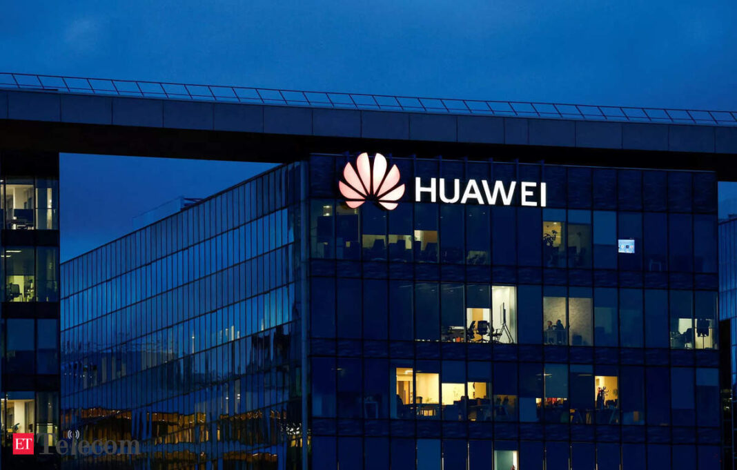 Huawei office building illuminated at dusk