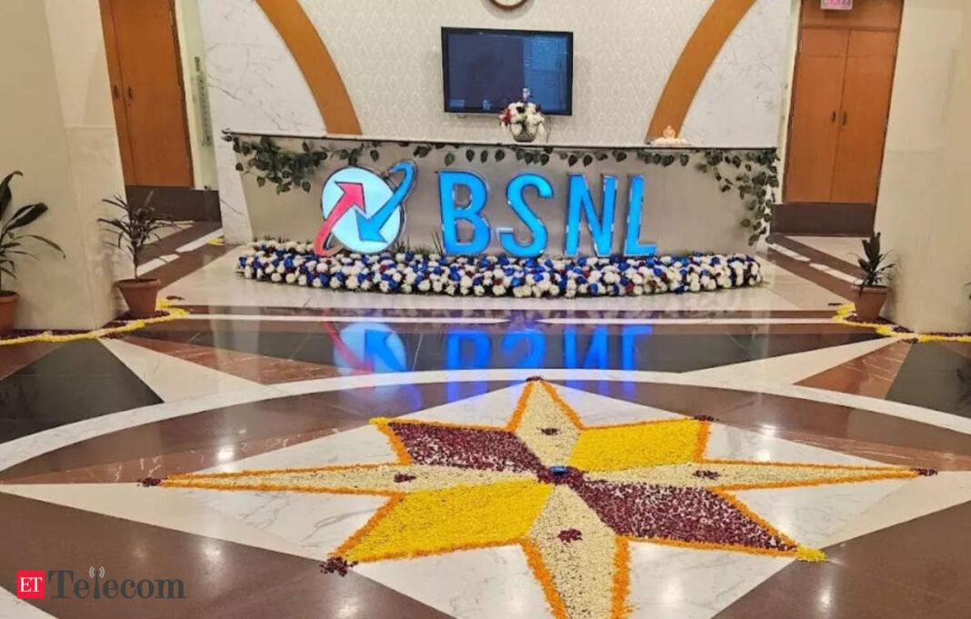 BSNL logo in office lobby with floral decoration.