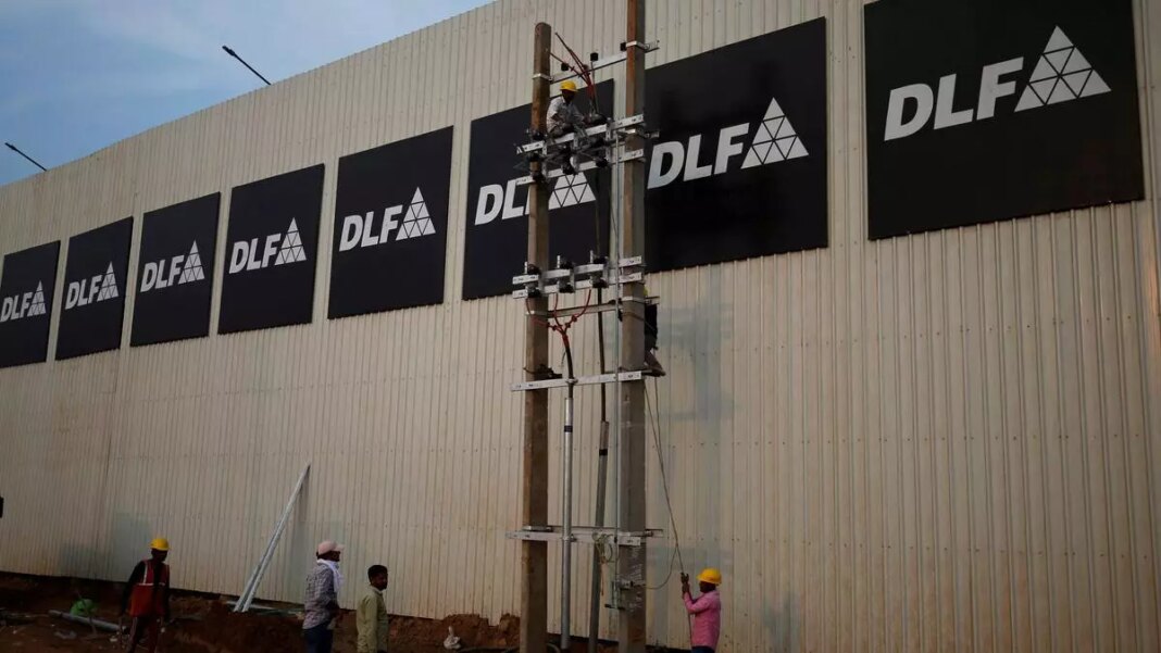 Workers installing signage on building exterior.