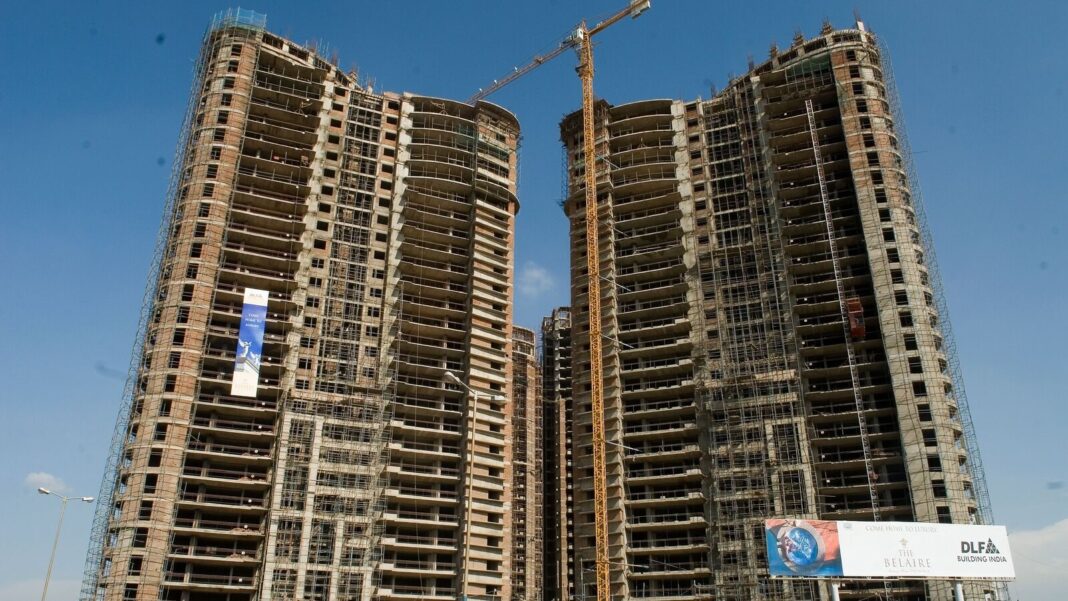 High-rise buildings under construction with crane.