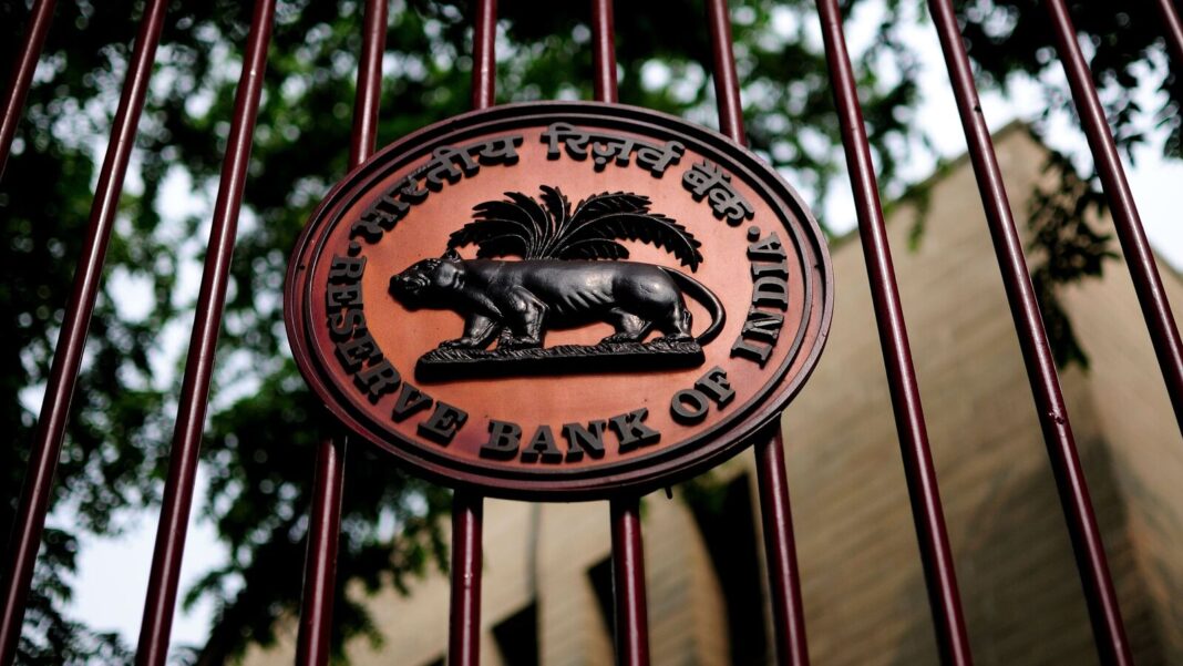 Reserve Bank of India emblem behind bars.