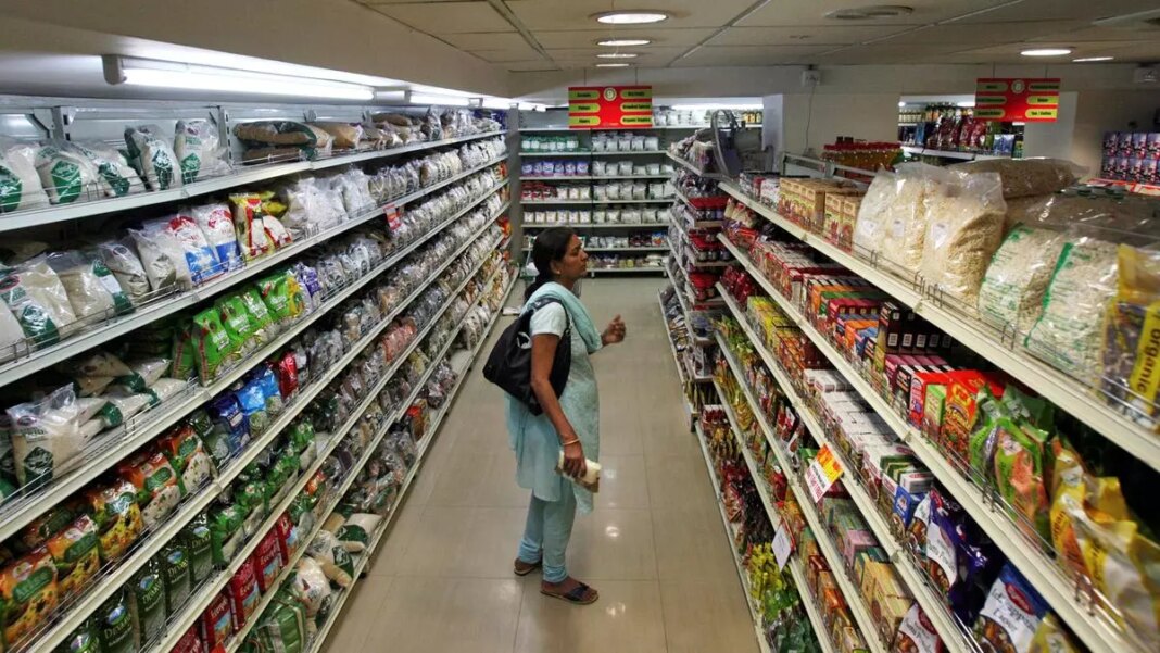 Customer browsing grocery store aisle.