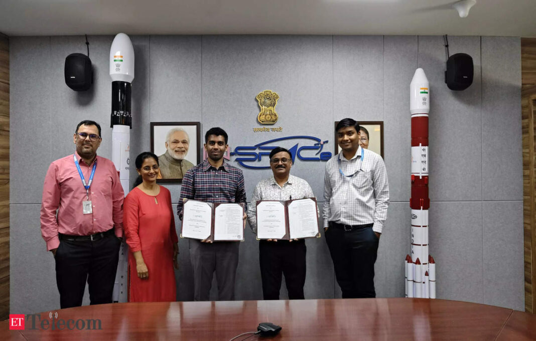 Group of professionals posing with certificates in office.