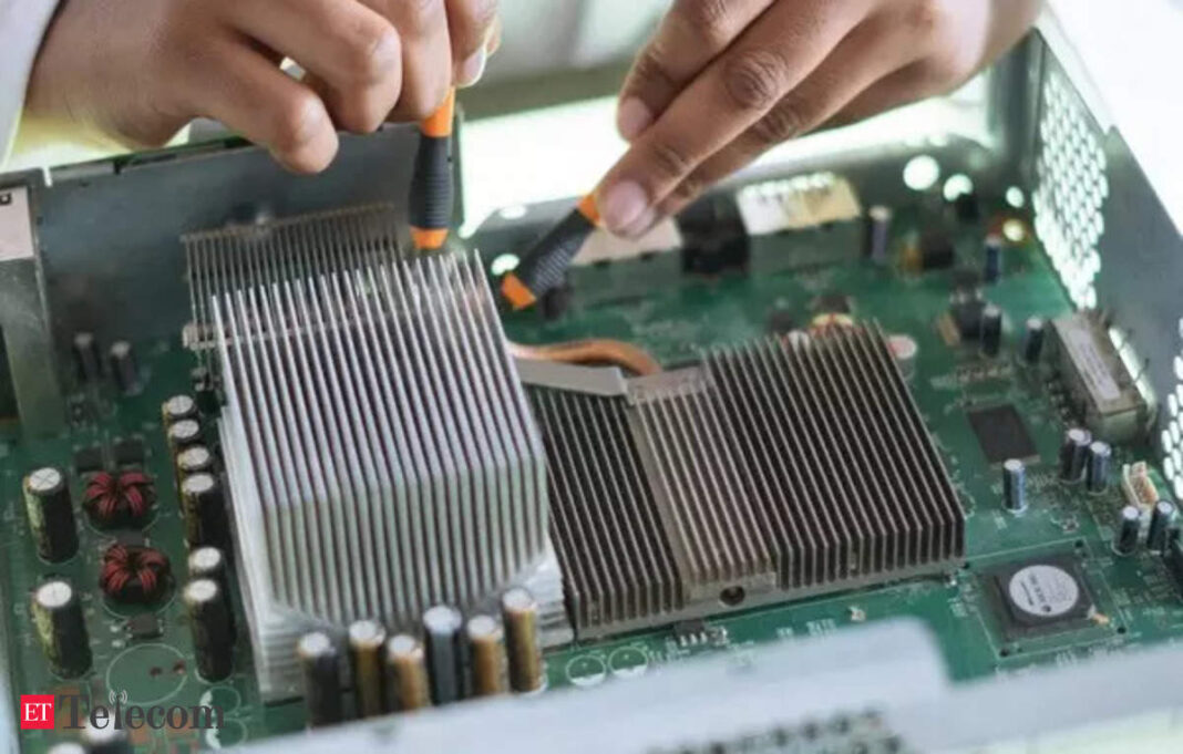 Technician repairing computer hardware motherboard.