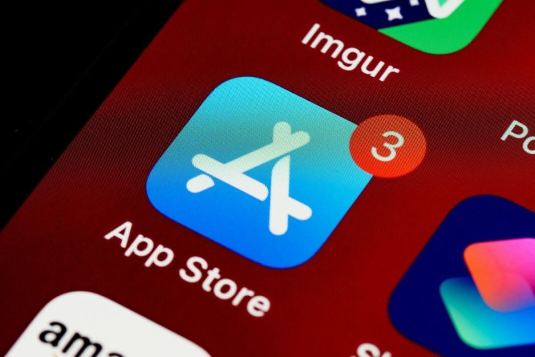 App Store icon with notifications on smartphone screen.