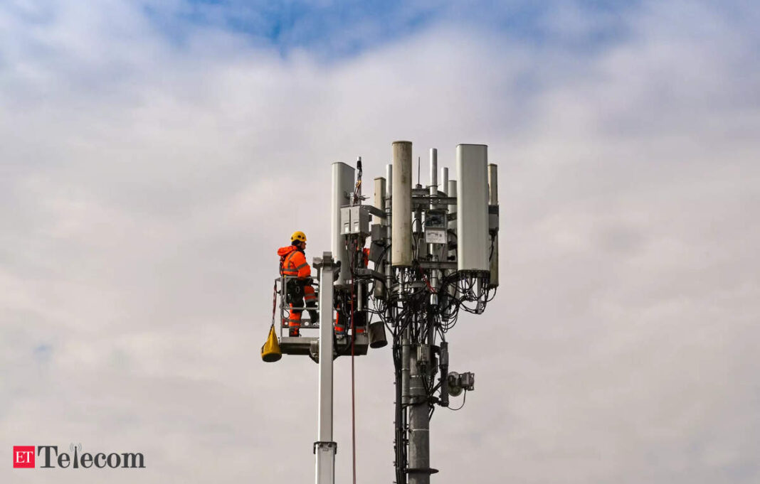 Technician repairing cellular tower equipment.