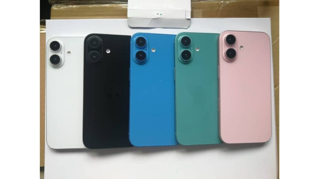 Four smartphones in white, black, blue, and pink.