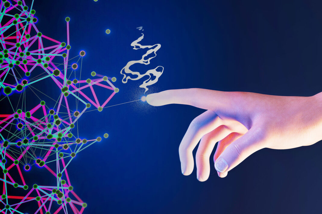 Human hand interacting with digital network nodes.