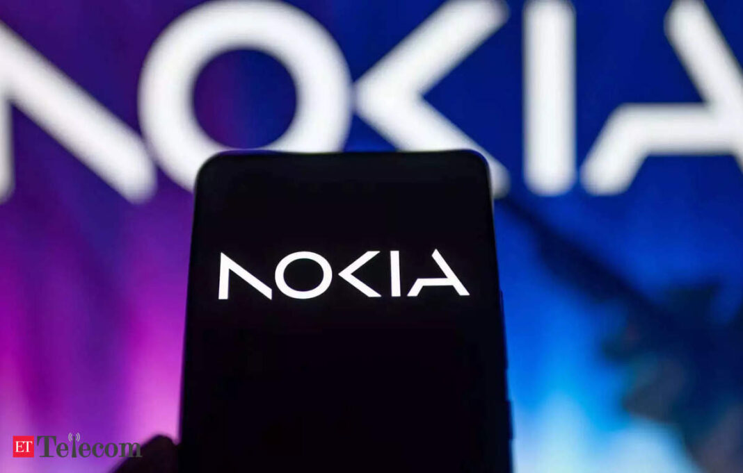 Nokia smartphone with logo illuminated on screen.