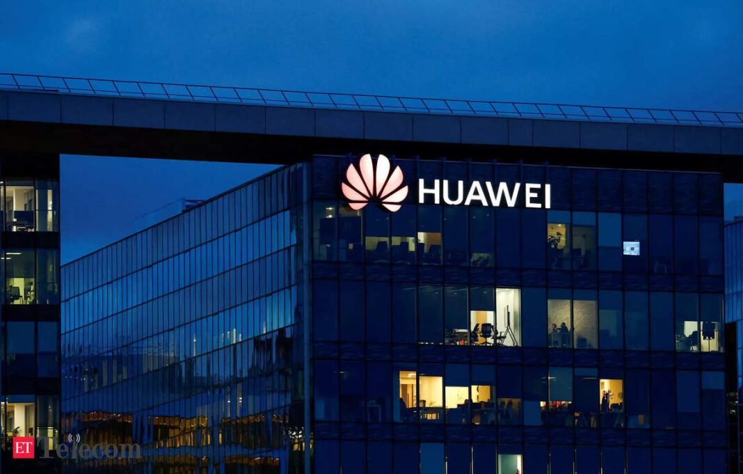 Huawei headquarters building illuminated at dusk.