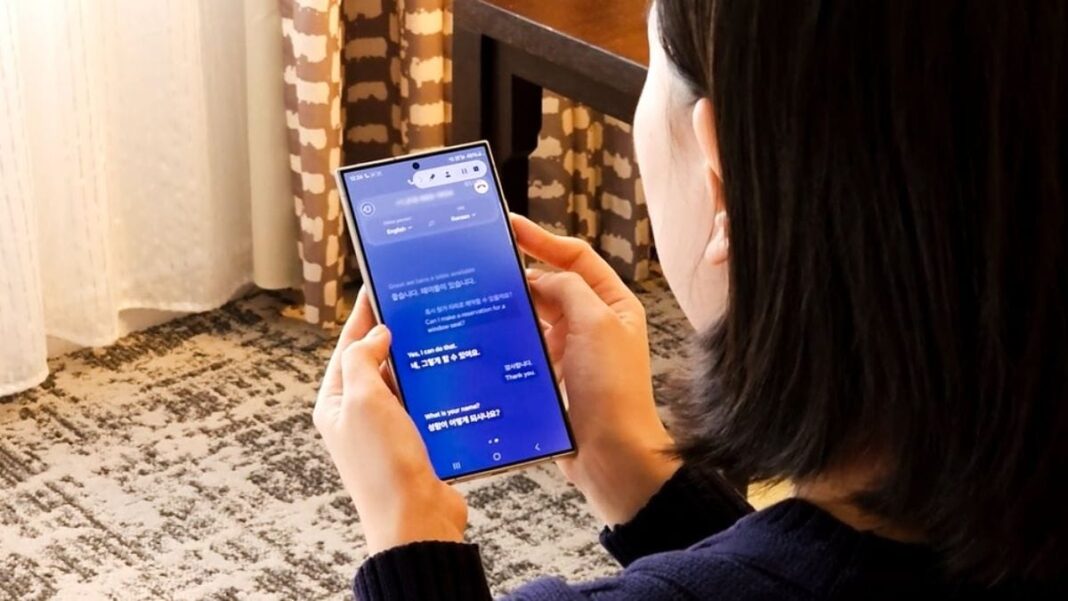 Person using smartphone with blue screen indoors.