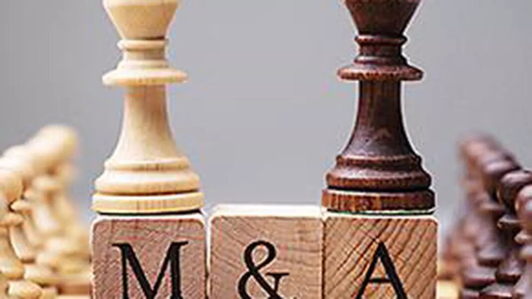 Chess pieces on blocks spelling "M&A" (mergers and acquisitions).