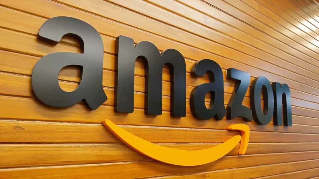 Amazon logo on wooden wall.
