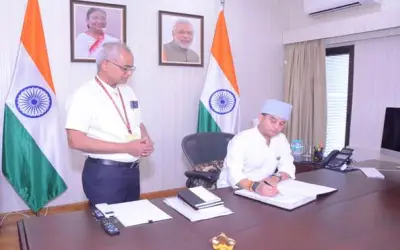 Two men in office with Indian flags.