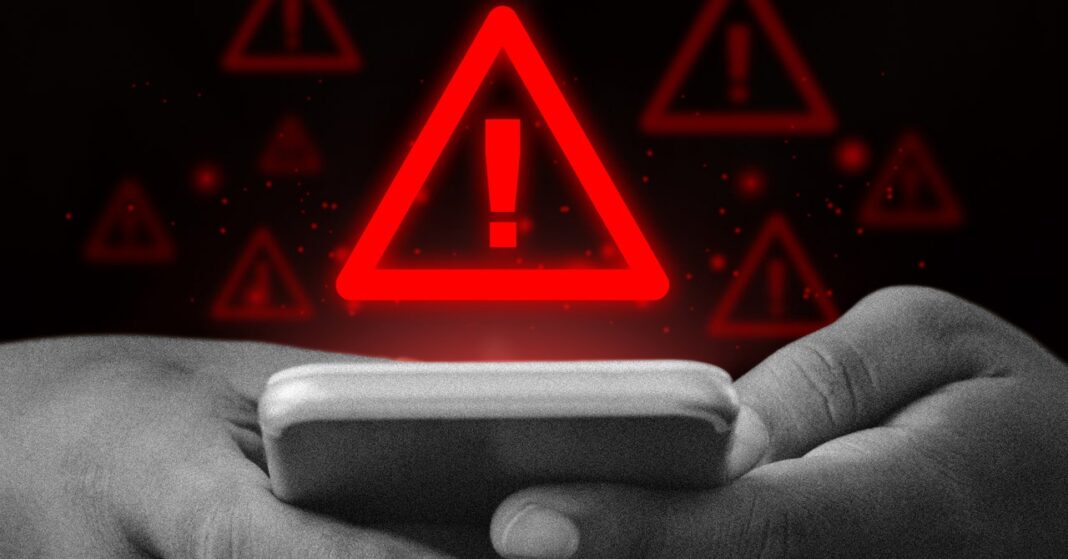 Hands holding phone with warning alerts background.